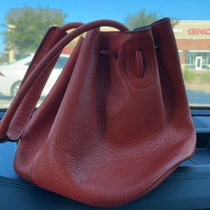 Rabeanco orange bucket bag. New. Never worn.